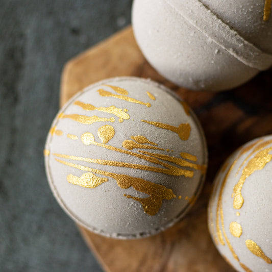 brown bath bomb with gold drizzle