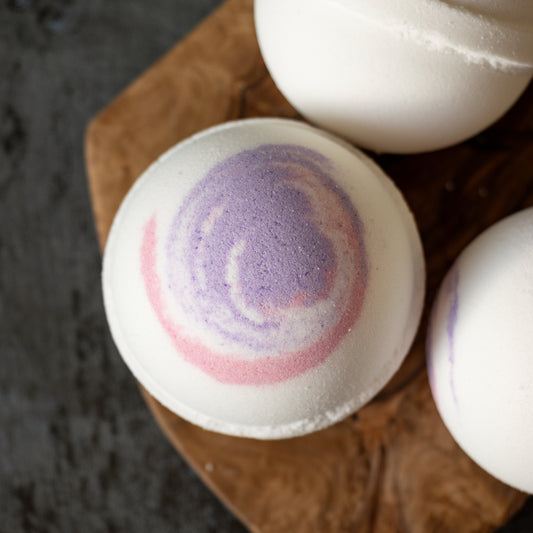 white bath bomb with purple & pink swirl