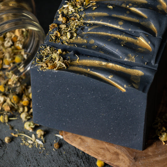 oat milk black chamomile soap with charcoal and chamomile flower